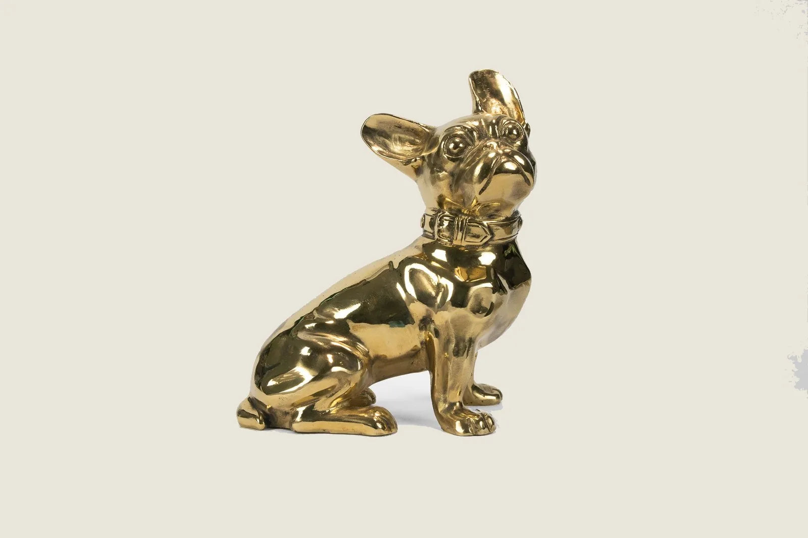 Handcrafted brass sculpture of a French Bulldog, showcasing a glossy golden finish and intricate detailing.
