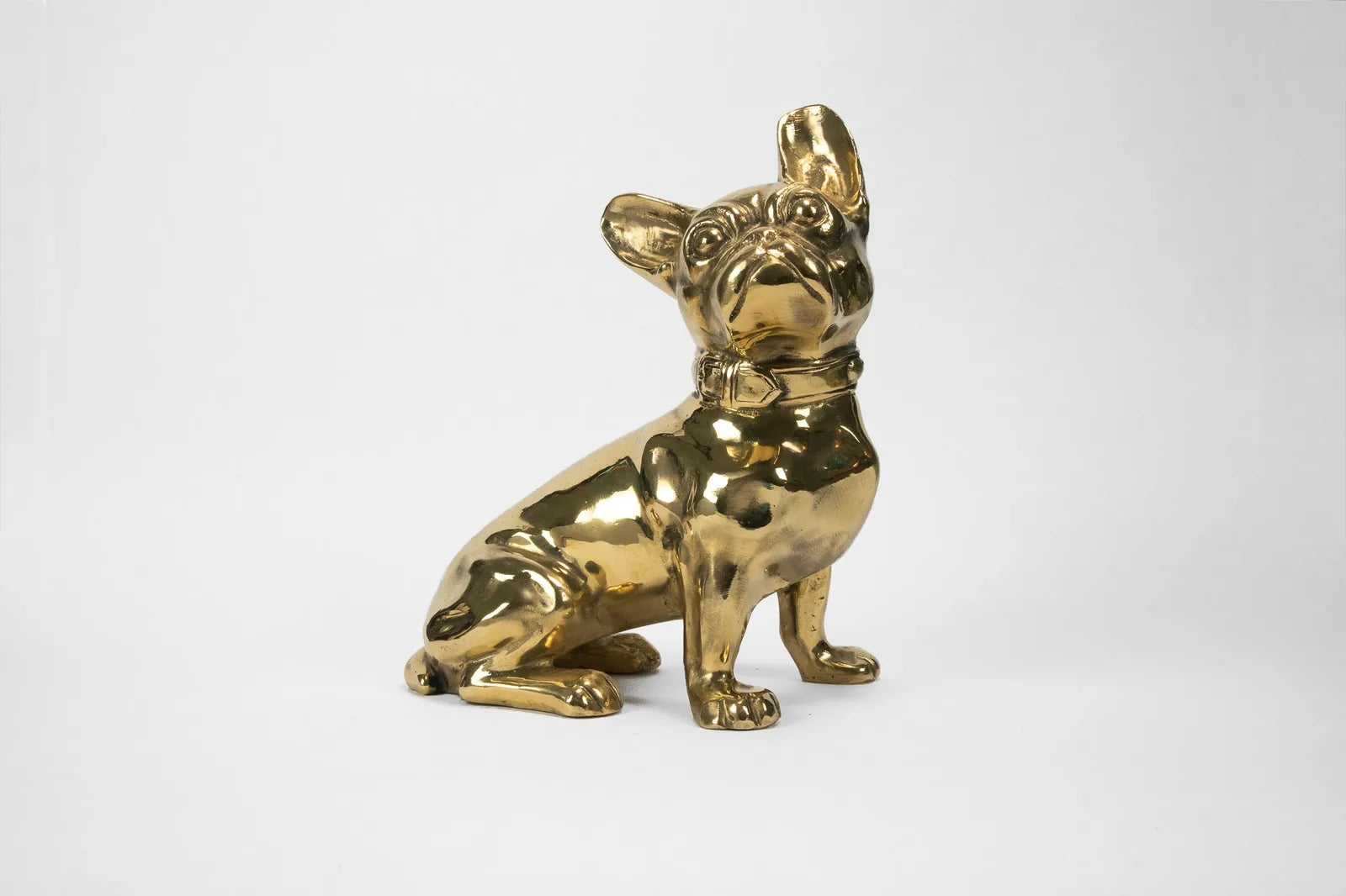 Handcrafted brass French Bulldog sculpture, polished for a glossy finish, featuring a vintage-inspired design.