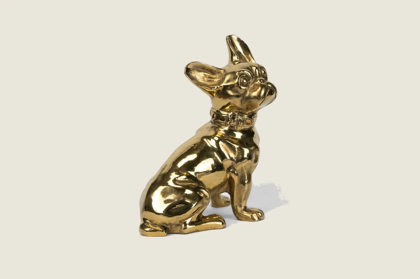 Handcrafted brass French Bulldog sculpture featuring a glossy finish, showcasing a vintage-inspired design.