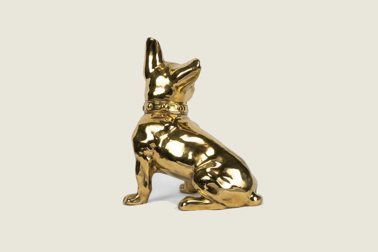 Handcrafted brass French Bulldog sculpture with a glossy finish, showcasing intricate detailing and a vintage-inspired des...
