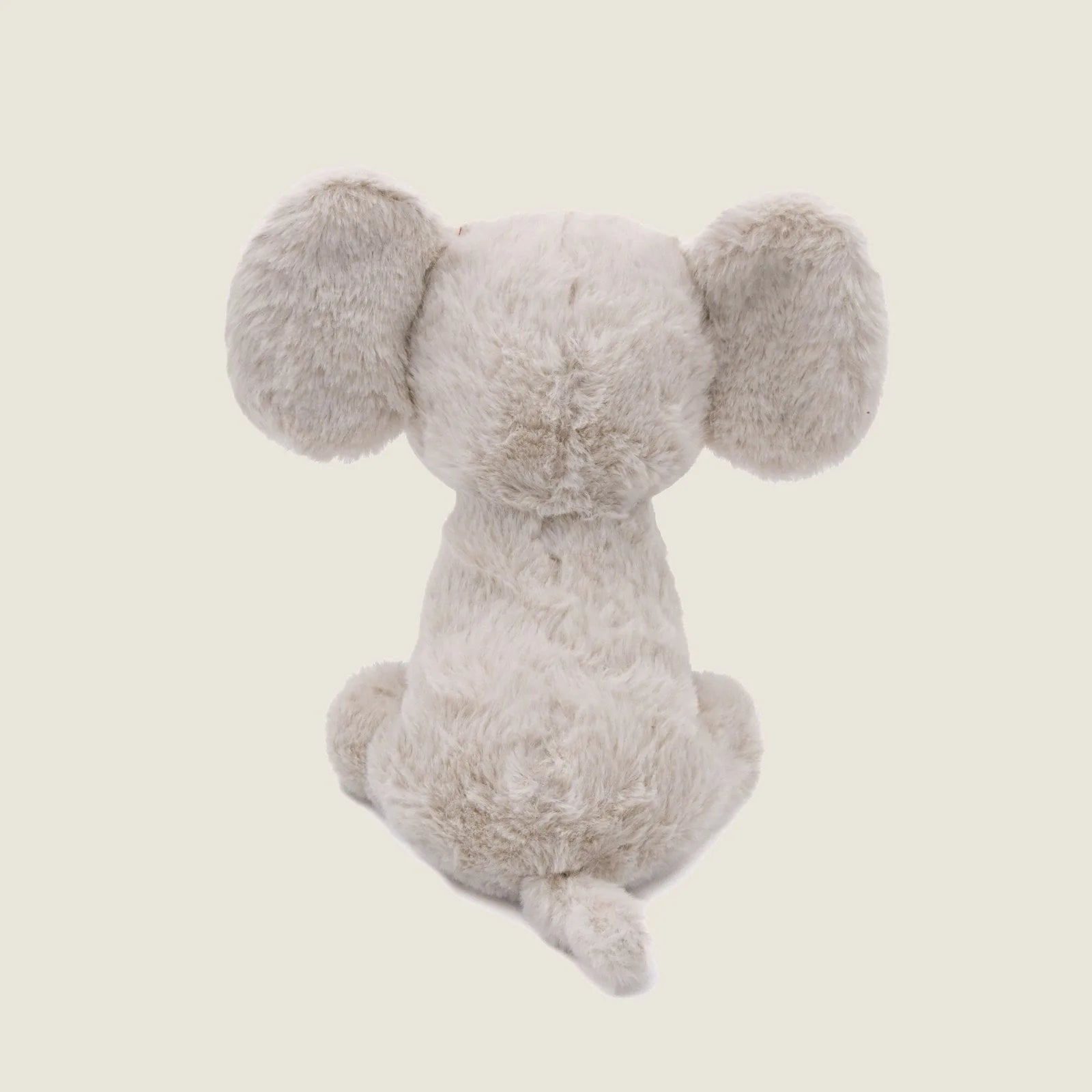 Soft beige plush elephant toy with large ears, crinkly texture, and a small tail, designed for gentle dog play.