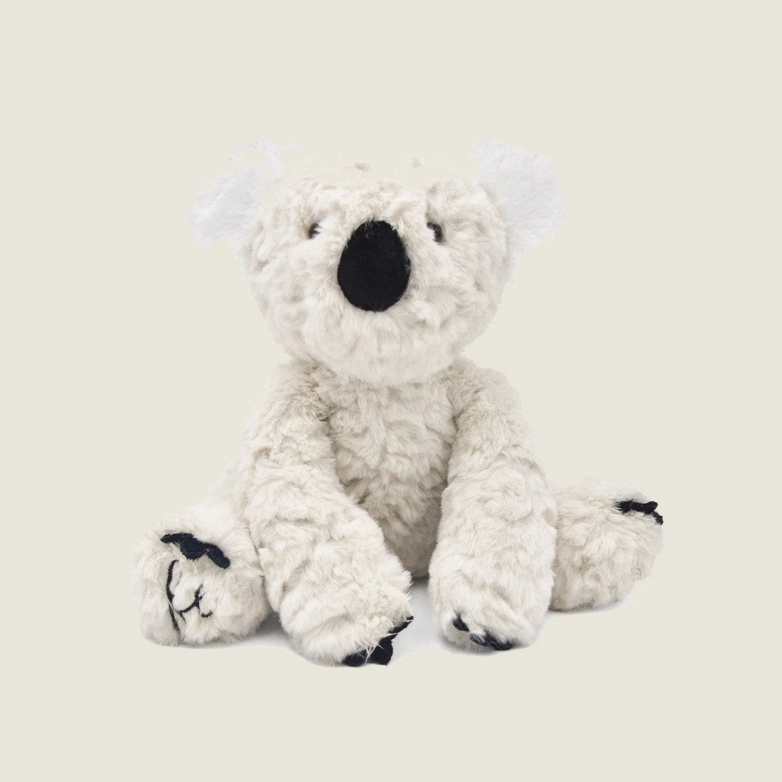 Soft, cream-colored Koko the Koala plush toy with crinkly ears and a gentle squeaker, perfect for dogs to cuddle.