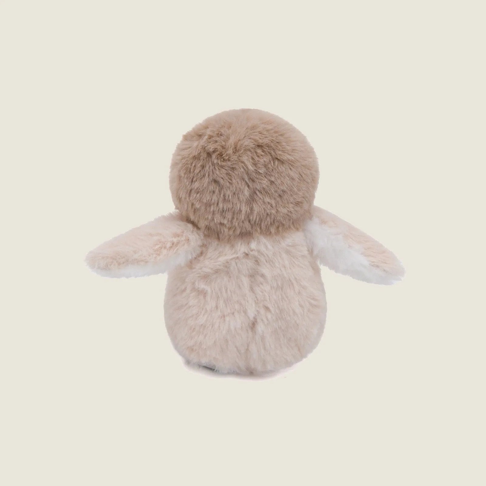 Soft beige plush penguin toy with crinkly wings, ideal for gentle play and cuddling by dogs.