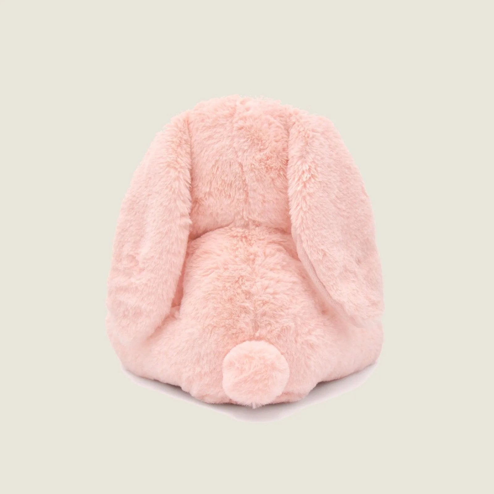 Soft pink plush rabbit toy featuring long floppy ears and a round tail, perfect for cuddling and gentle play.
