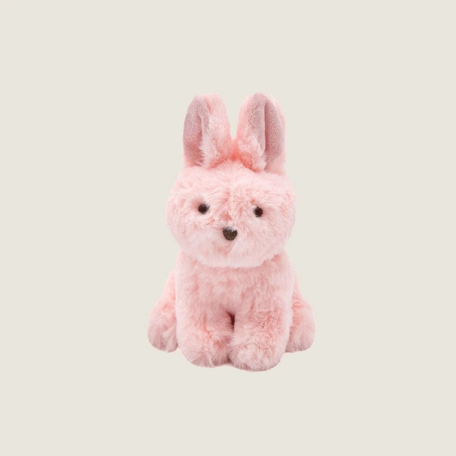 Soft pink rabbit plush toy with upright ears and a friendly face, perfect for gentle play and cuddling.