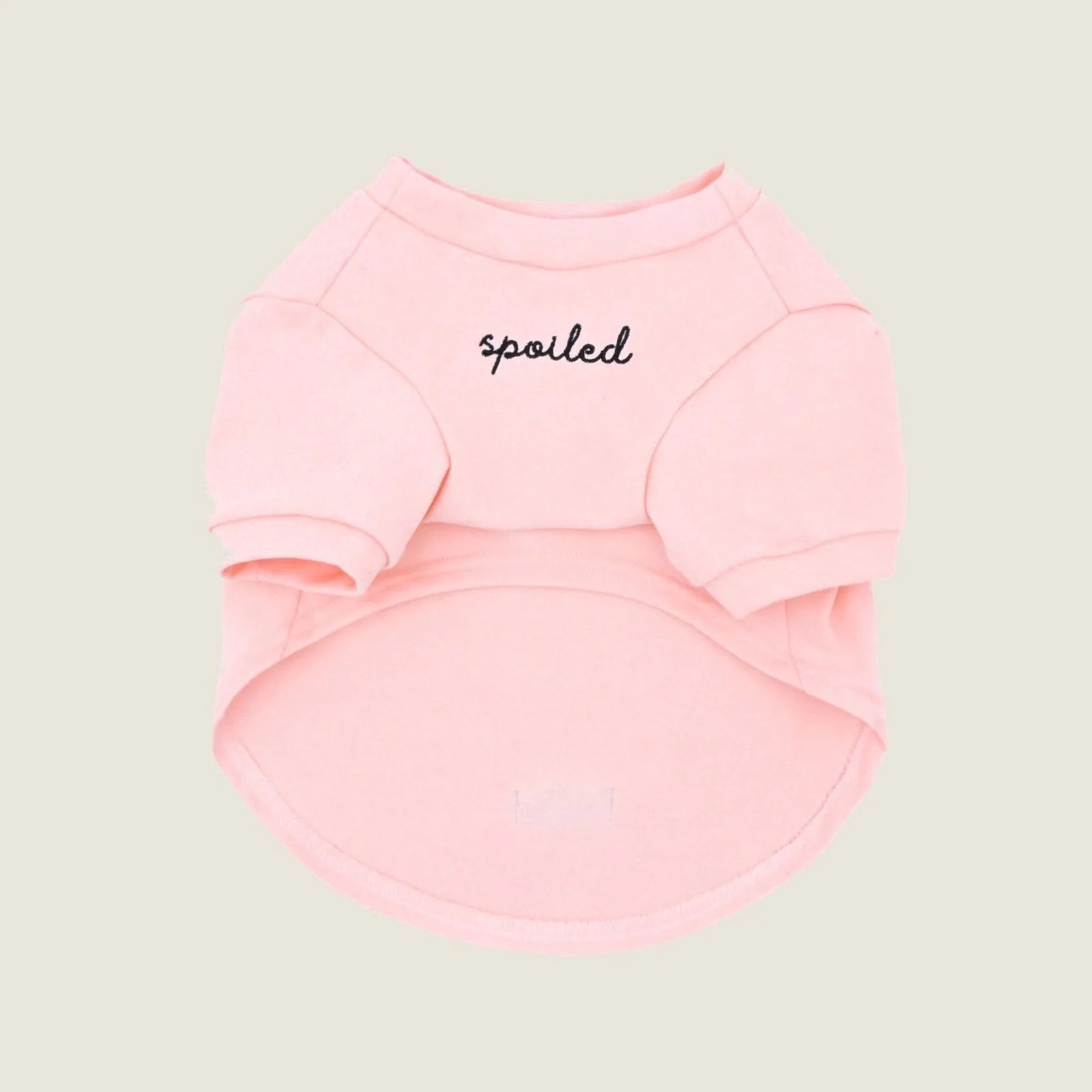 Blush pink fleece dog shirt featuring "spoiled" embroidery, designed for comfort and style in small to large breeds.
