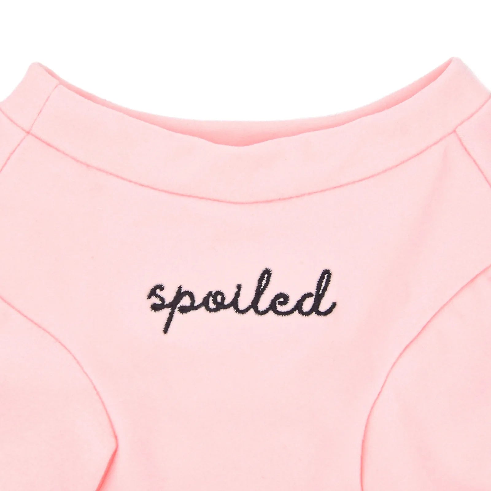 Blush fleece dog shirt with embroidered "spoiled" text on the back, part of the Spoiled Sweetheart Collection.