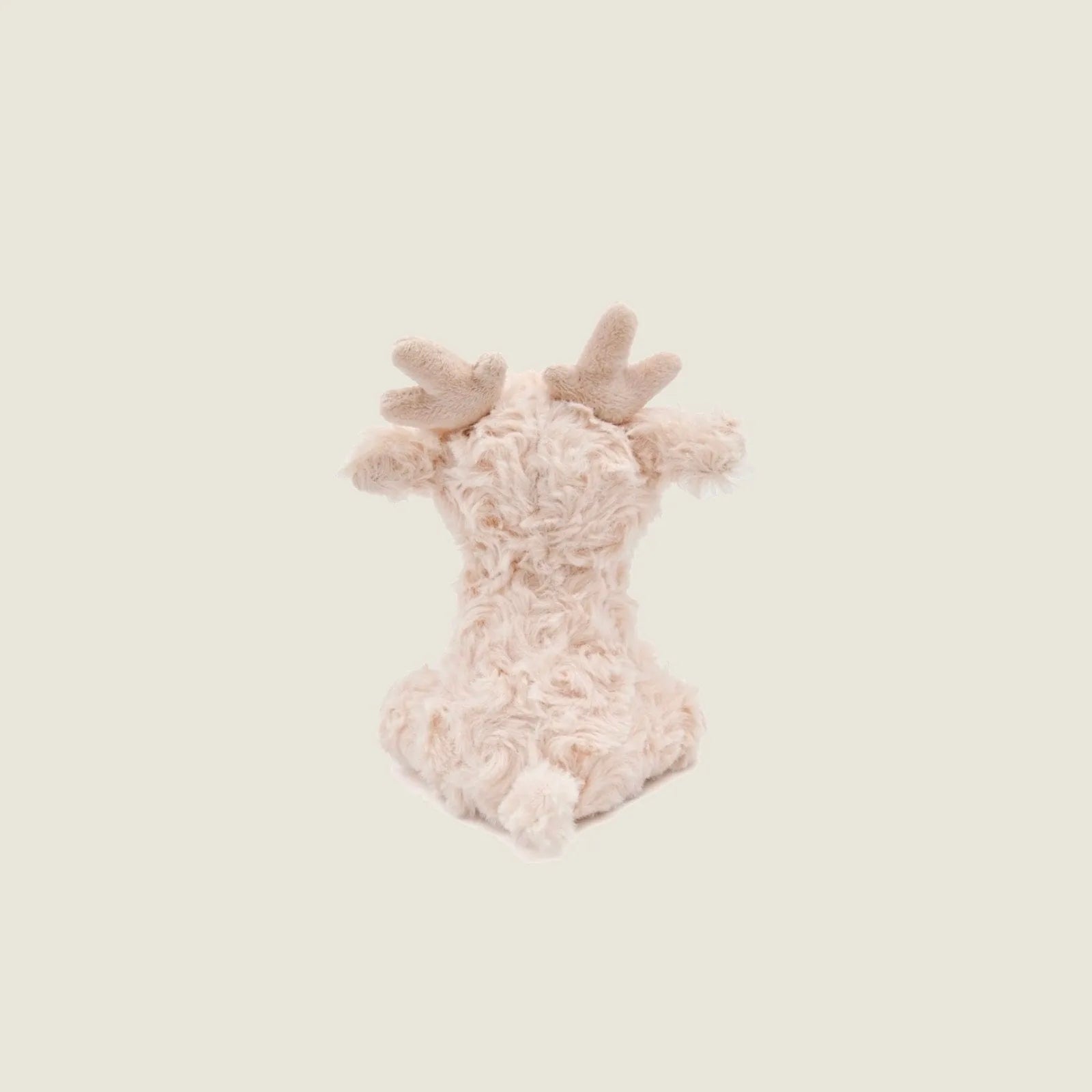 Soft beige plush reindeer toy with antlers, crinkly ears, and gentle jingle designed for dogs to cuddle and play.