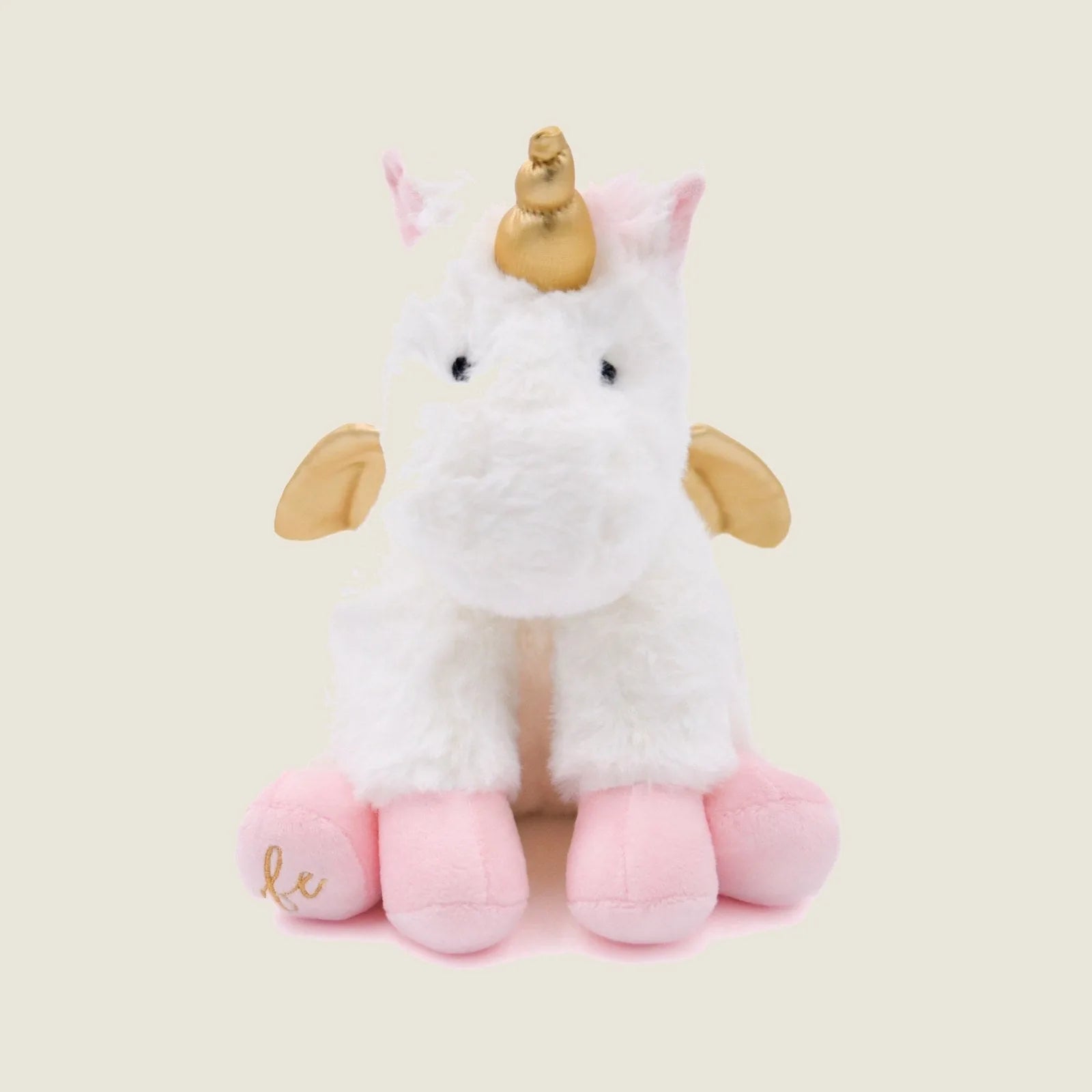 Soft white unicorn plush toy with gold accents, pink feet, and crinkly ears, designed for gentle play and cuddling.