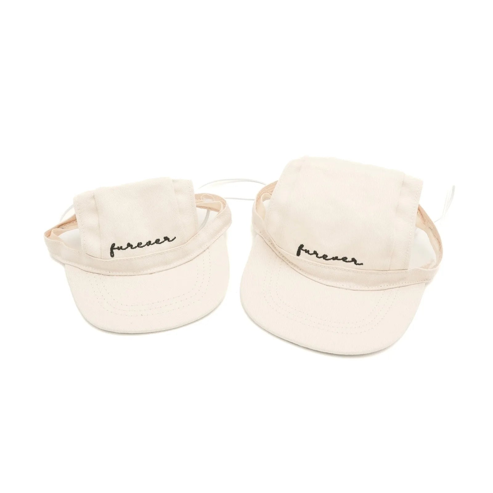 Lightweight cream pet hats with adjustable straps and embroidered 'furever' text for stylish sun protection.