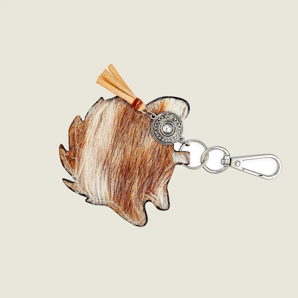 Brown leather dog-shaped key fob with a silver metal ring and a tassel accent. Perfect accessory for dog lovers.