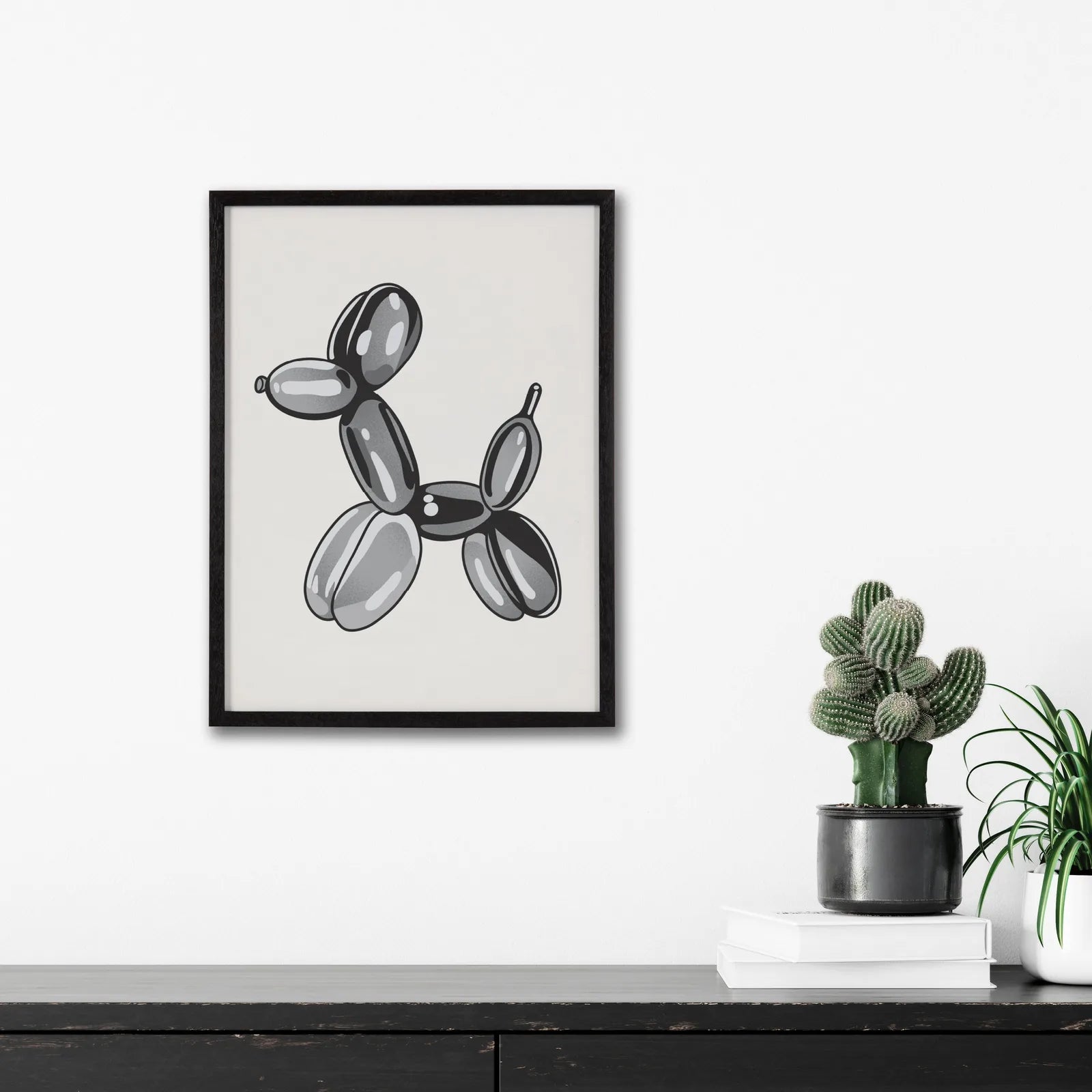 Framed black balloon dog art print in a sleek solid wood frame, adding a playful touch to modern decor.