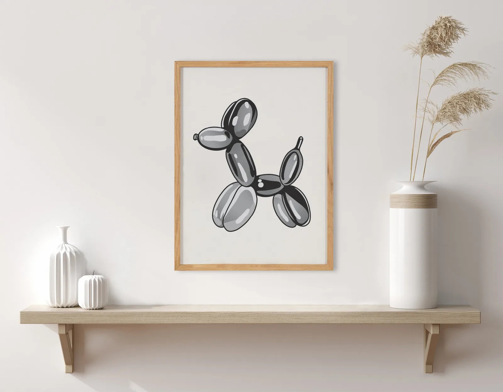 Framed black balloon dog art on cream background, showcasing a playful design in a simple wood frame.