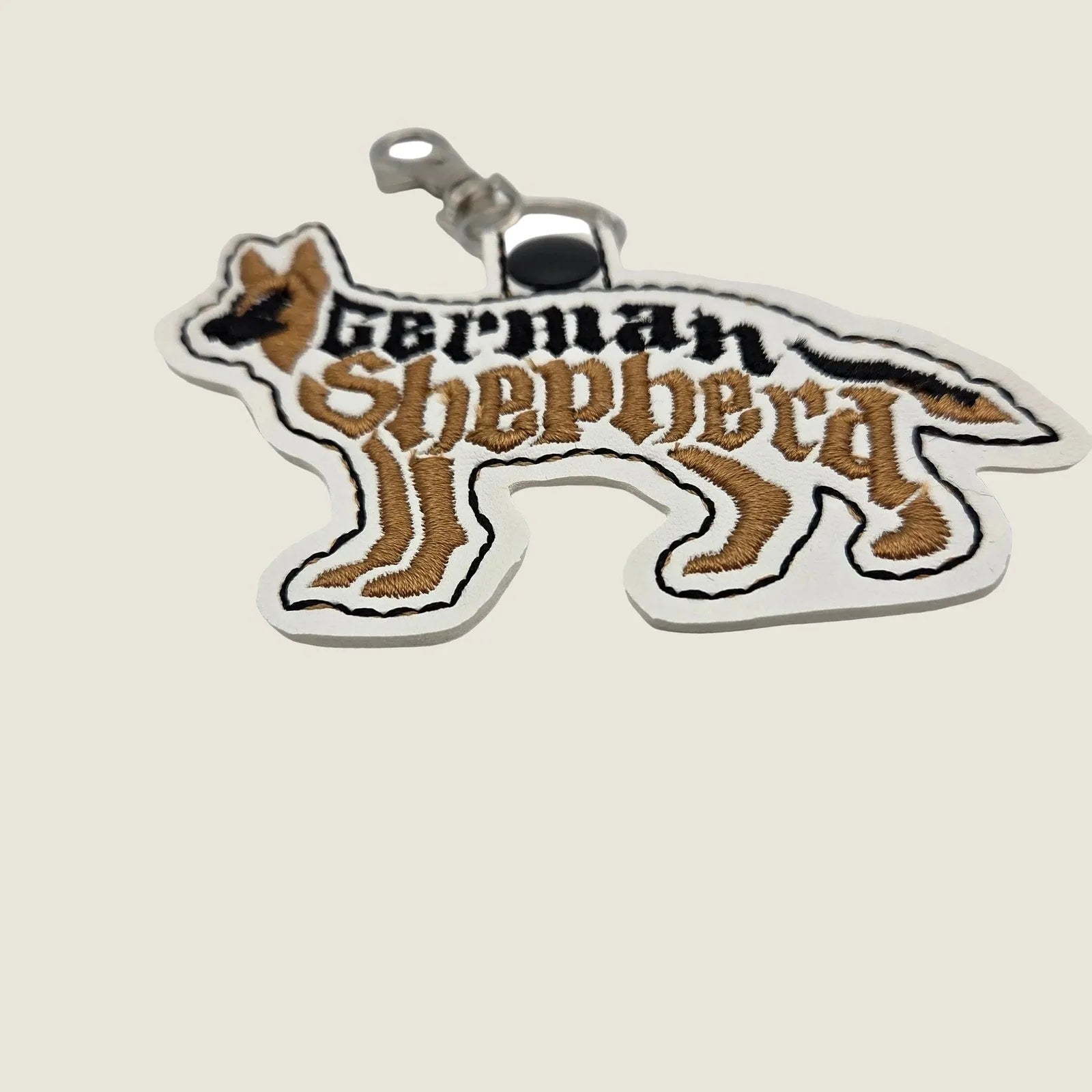 Embroidered German Shepherd keychain with a silhouette design and a secure swivel clip, perfect for dog lovers.