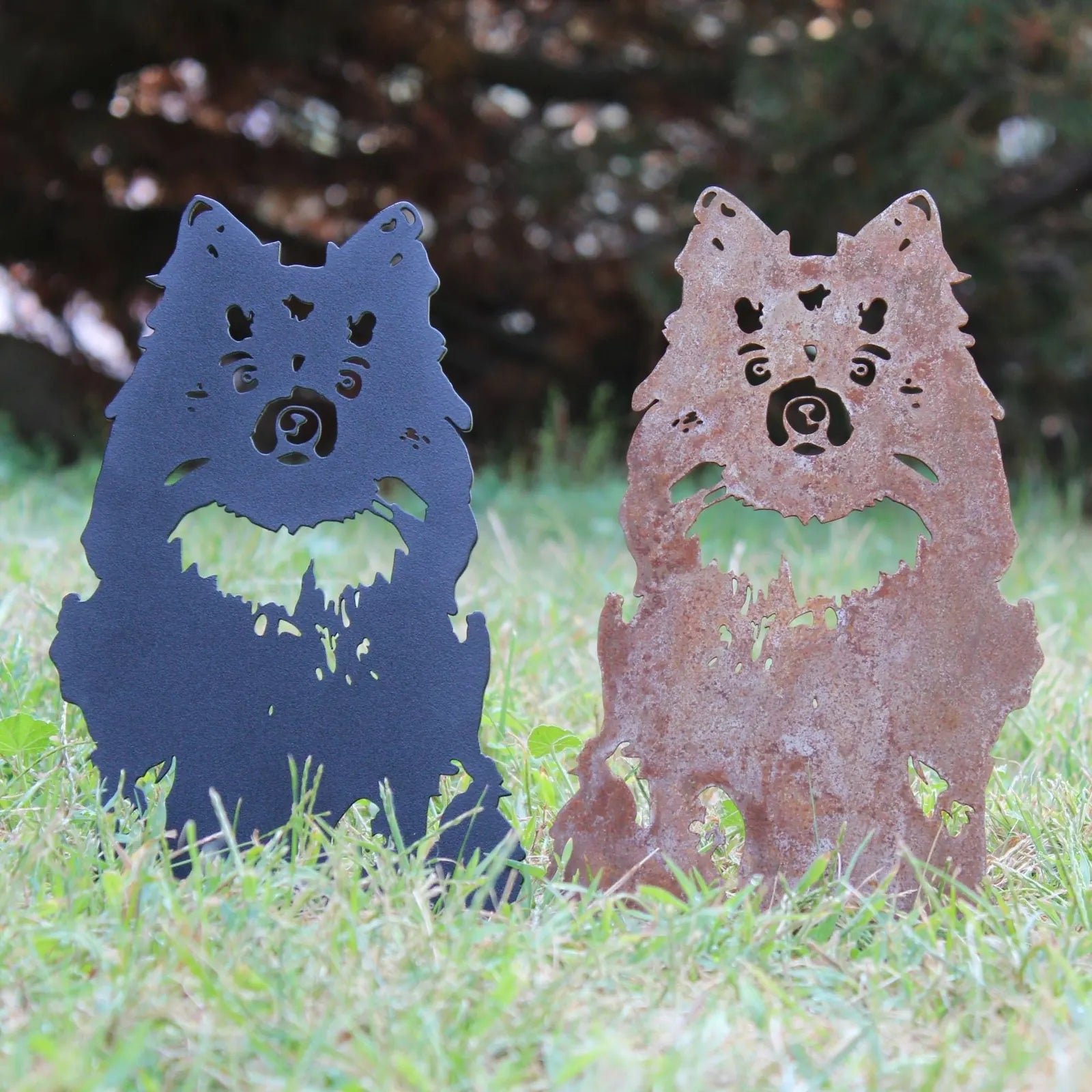Handmade German Spitz metal silhouette wall art in black and Corten steel, perfect for indoor or outdoor decor.