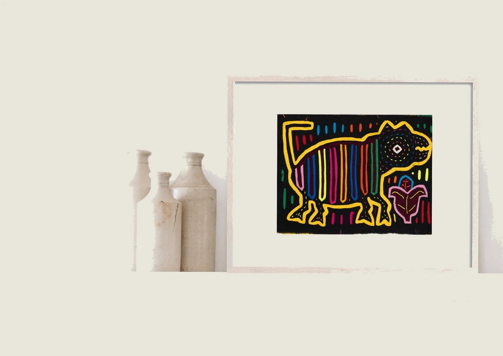 Colorful hand-stitched Mola featuring a golden retriever with geometric patterns, set against a black background.