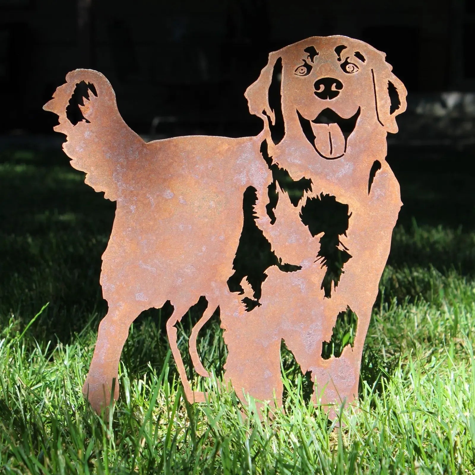 Rusty Corten steel silhouette of a Golden Retriever standing in grass, showcasing its playful design and detailed features.