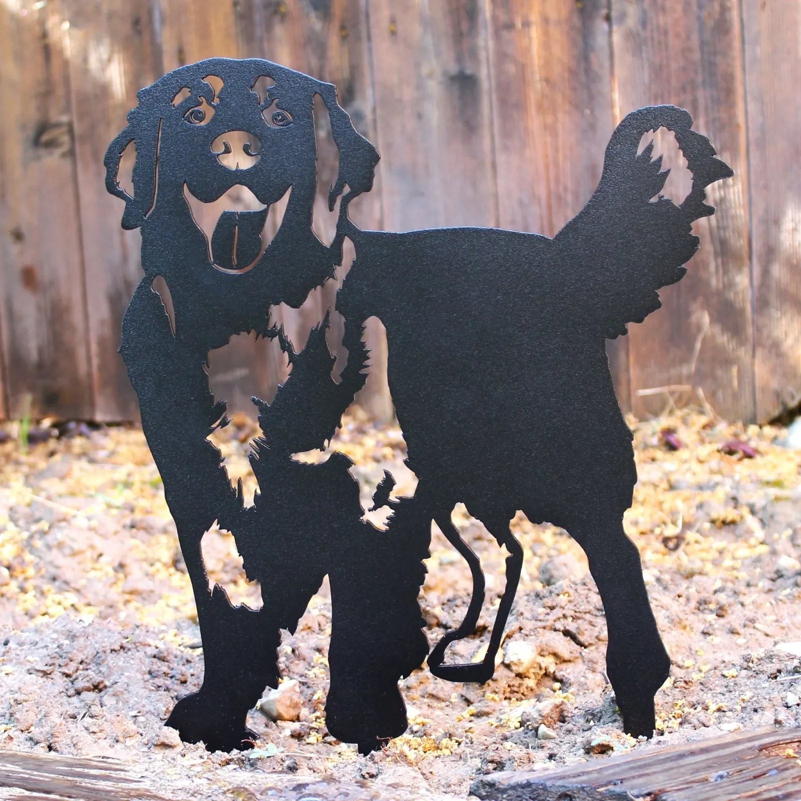 Black metal silhouette of a playful Golden Retriever, showcasing detailed cutouts, perfect for outdoor decor.