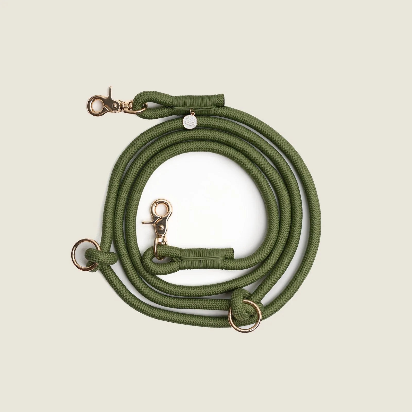 Hands-free braided leash in green with stylish rose gold clips and rings, designed for comfortable dog walking.