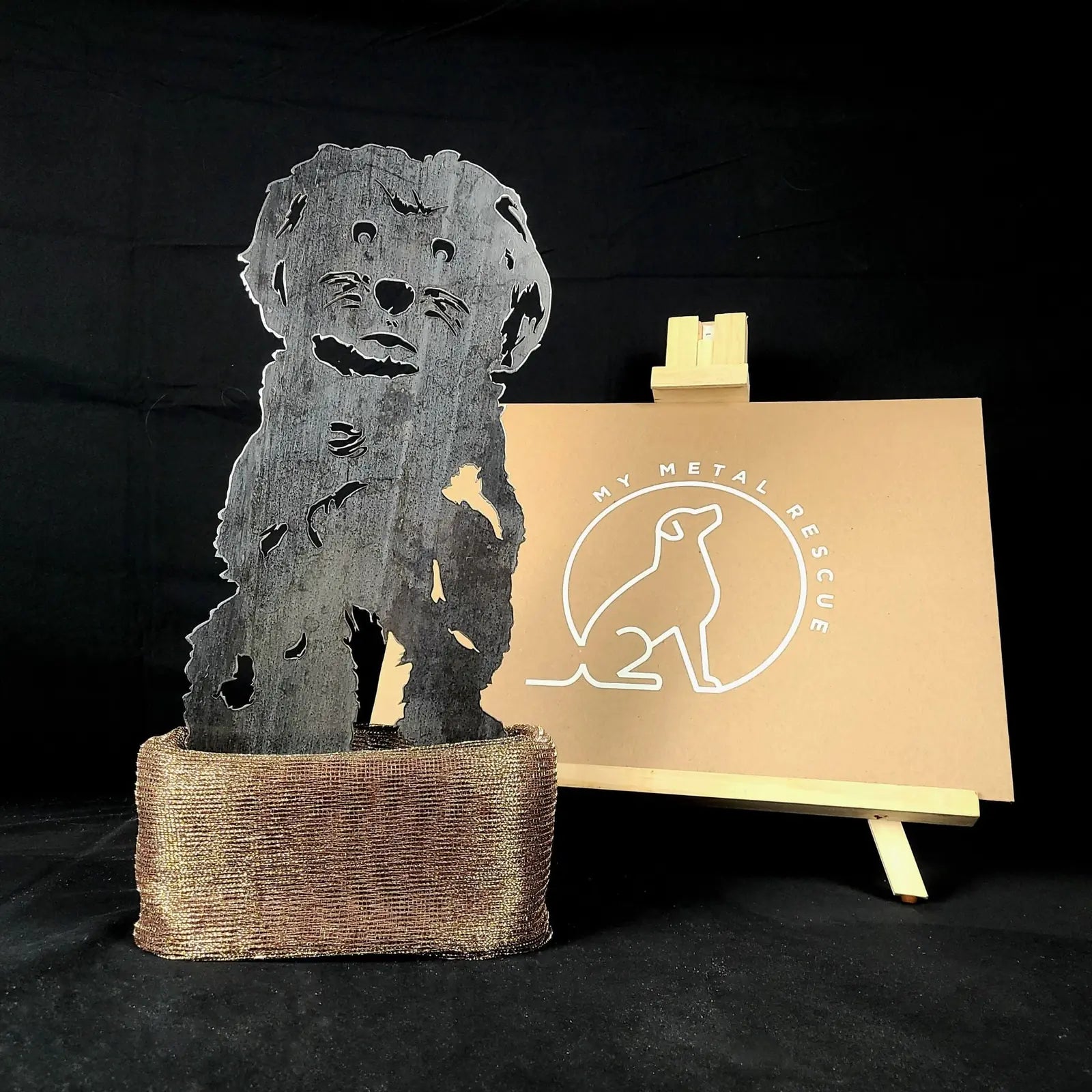 Havanese metal silhouette in black, set on a textured base, showcasing intricate cut-out details.