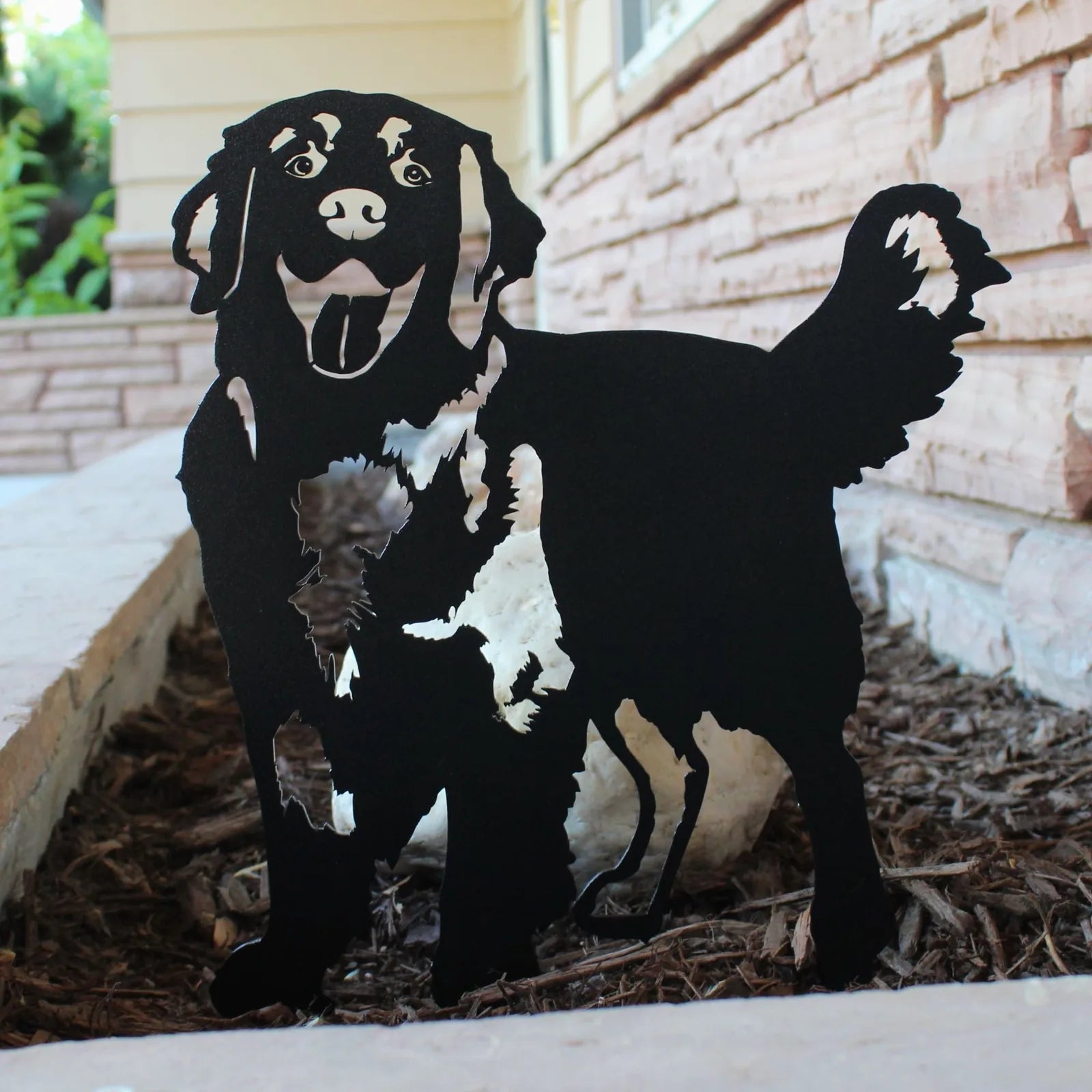 Black Hovawart dog silhouette made from durable metal, showcasing playful expression and detailed fur accents.