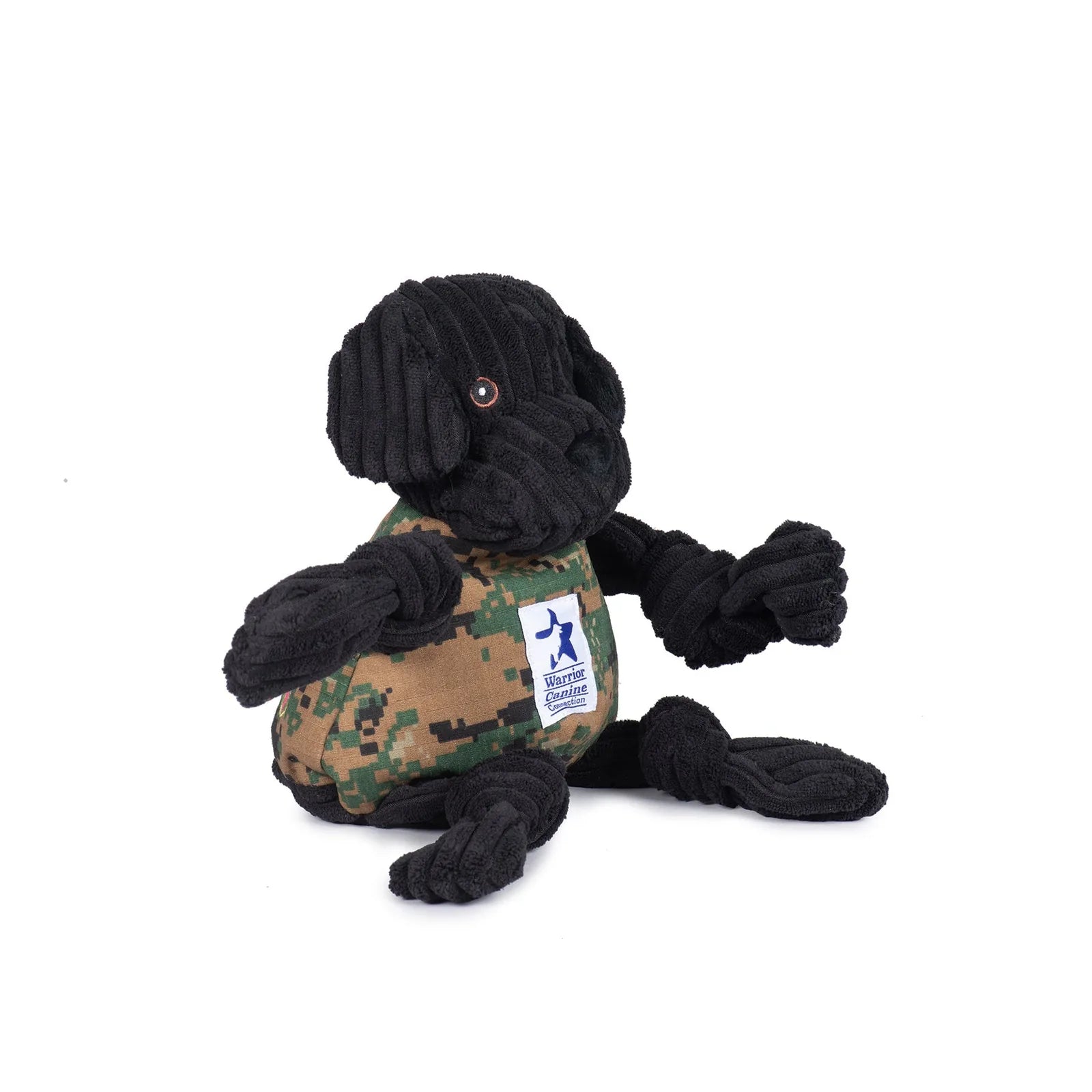 Black Lab plush dog toy with knotted limbs and camouflage vest, honoring service dogs from the Warrior Canine Connection.