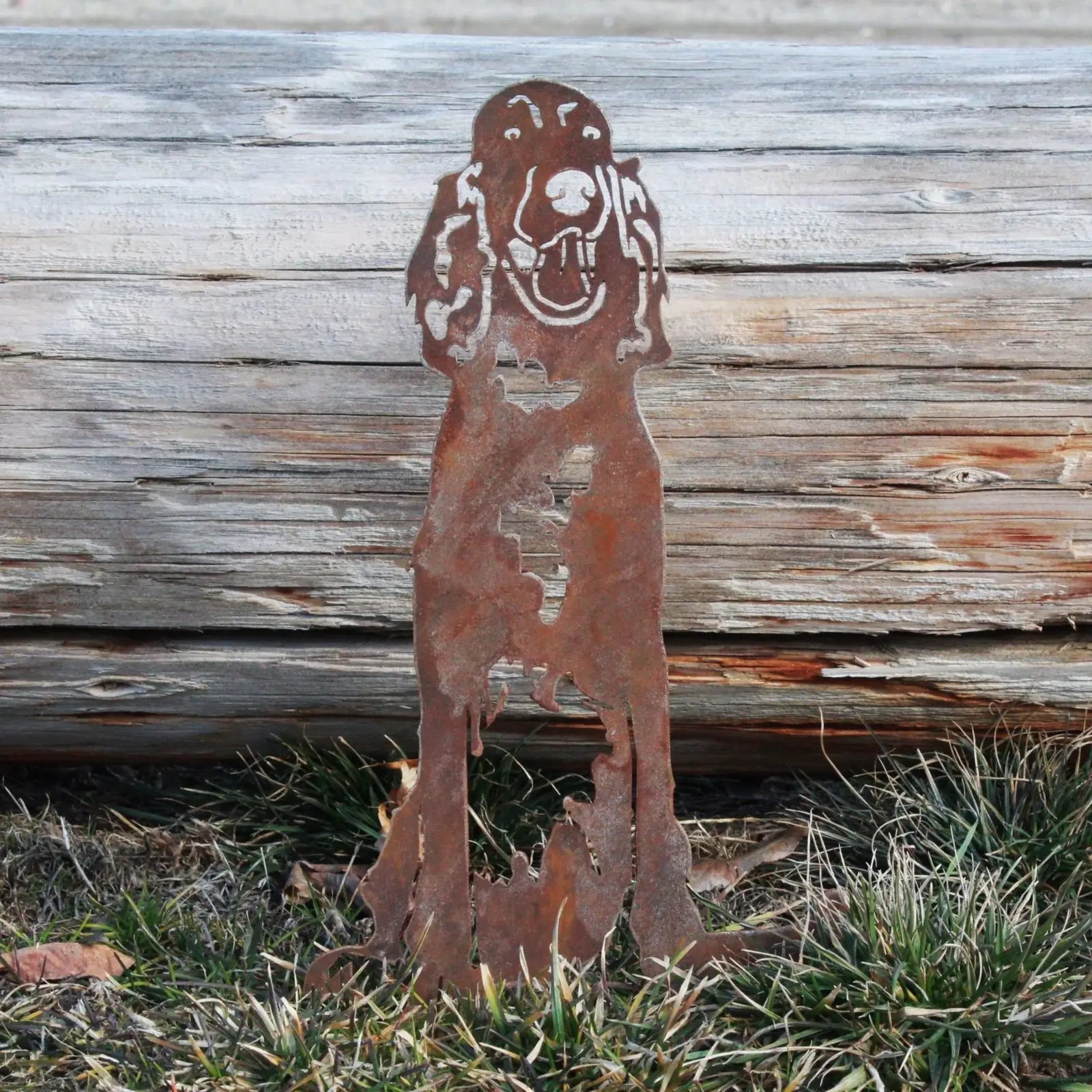 Rusty Corten steel Irish Setter silhouette standing in grass, showcasing detailed metal craftsmanship for outdoor decor.
