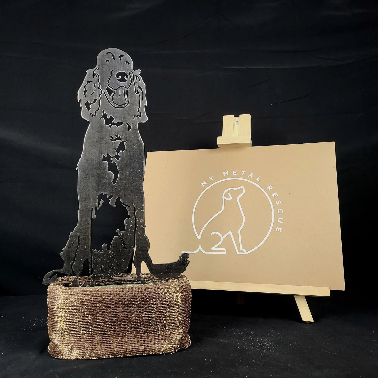 Irish Setter metal silhouette in dark metal finish, seated on a textured base, with My Metal Rescue branding in the backgr...