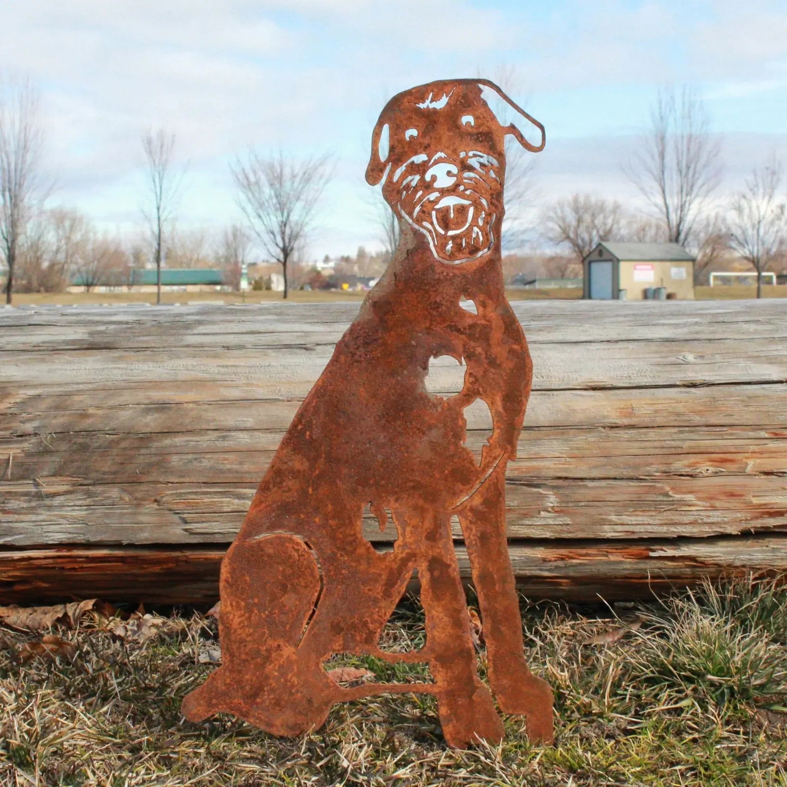 Rusty Corten steel Irish Wolfhound silhouette standing in grass, showcasing outdoor decor style and handmade craftsmanship.