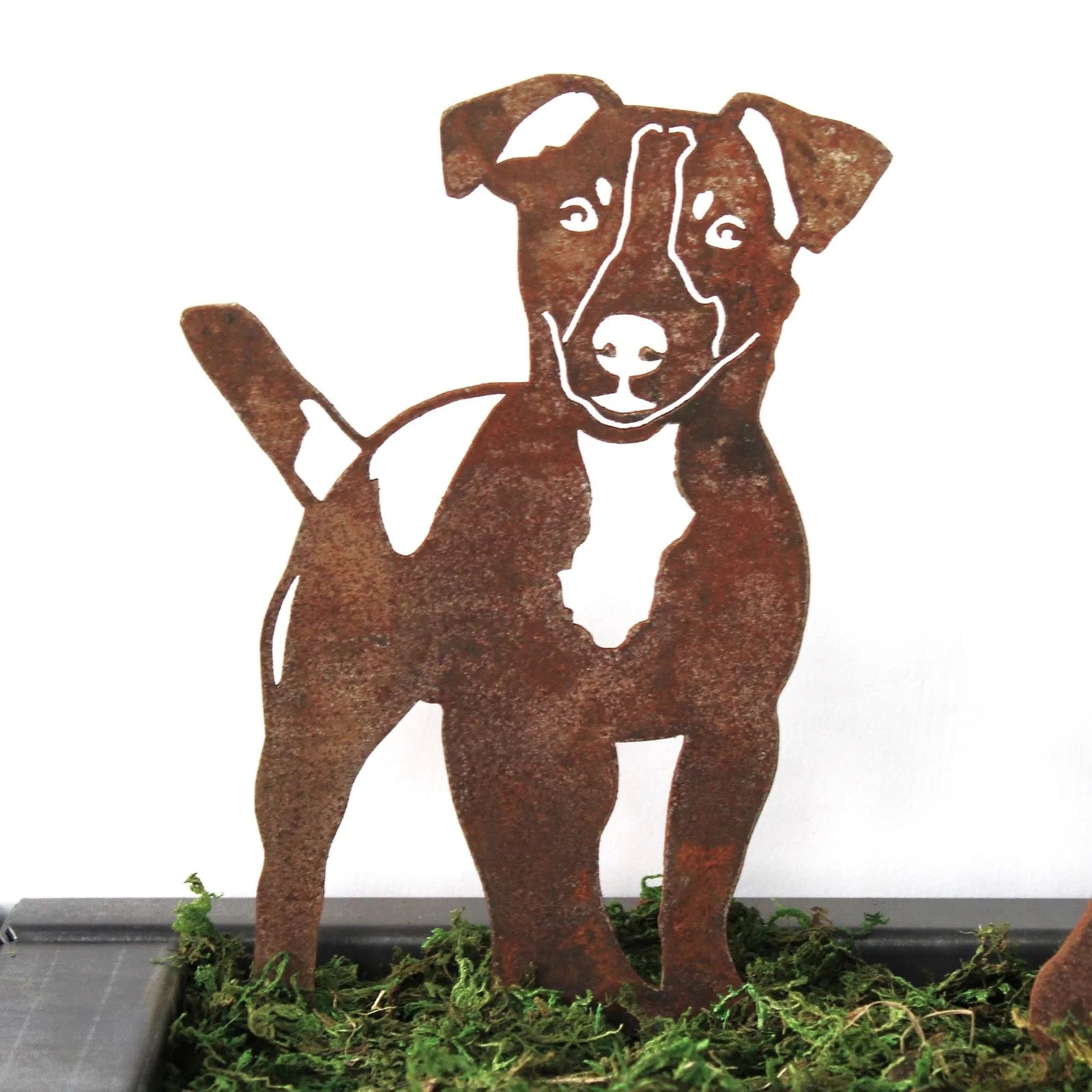 Rusty Corten steel silhouette of a Jack Russell Terrier, showcasing its playful stance, ideal for outdoor dog decor.