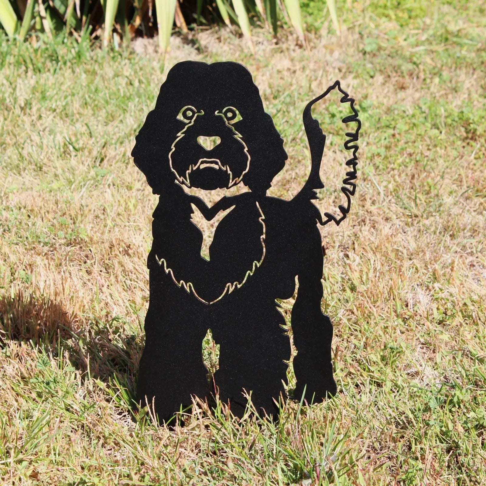 Black Labradoodle metal silhouette standing in grass, showcasing detailed design for outdoor decorative art.