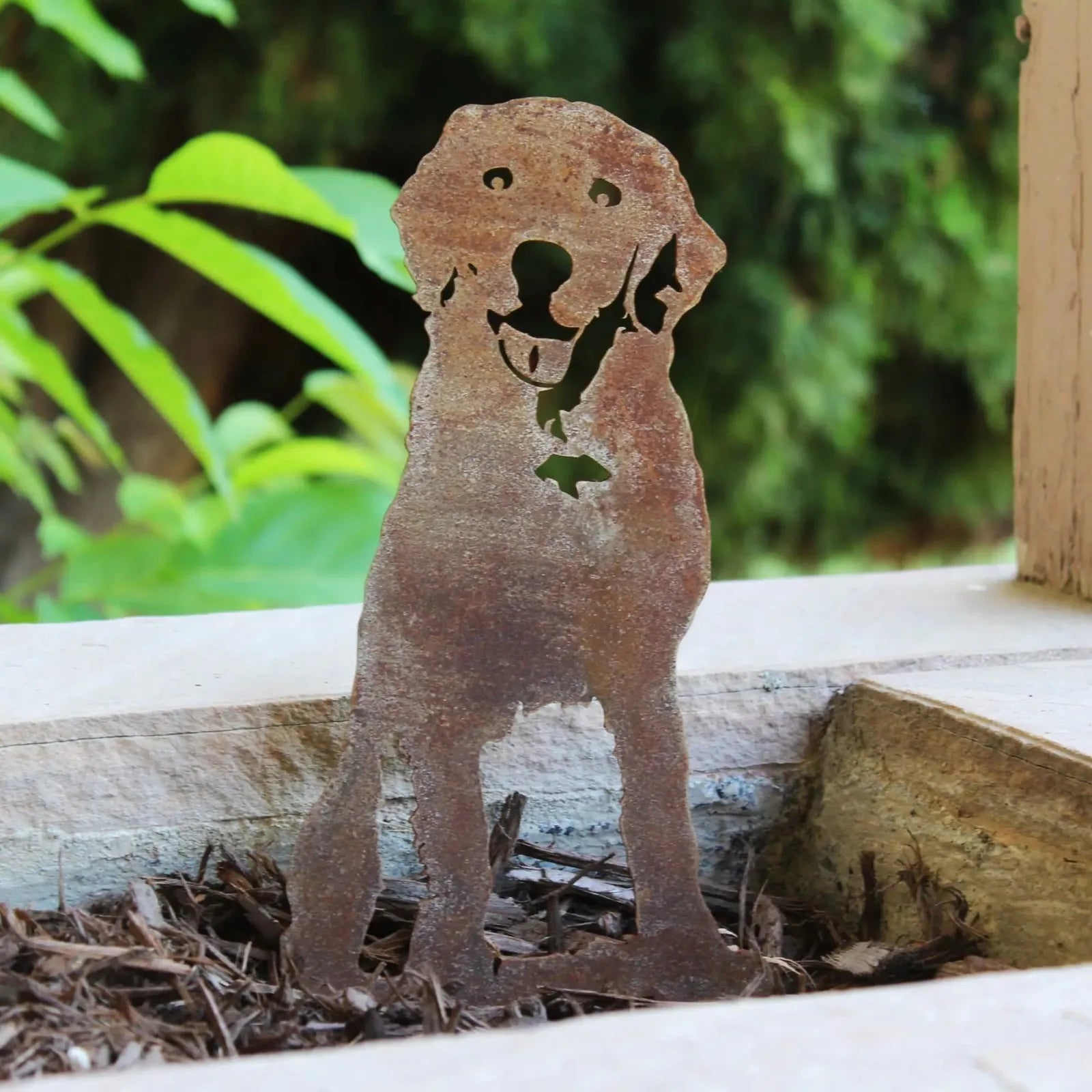 Handcrafted Labrador Retriever metal art in raw Corten steel, displaying a joyful silhouette for dog lovers.