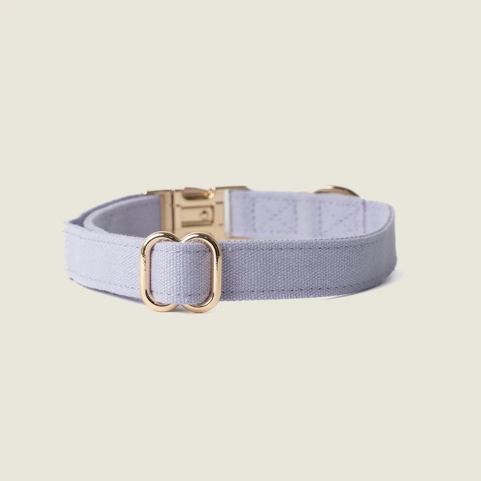 Lavender canvas dog collar featuring gold hardware, designed for comfort and everyday wear.