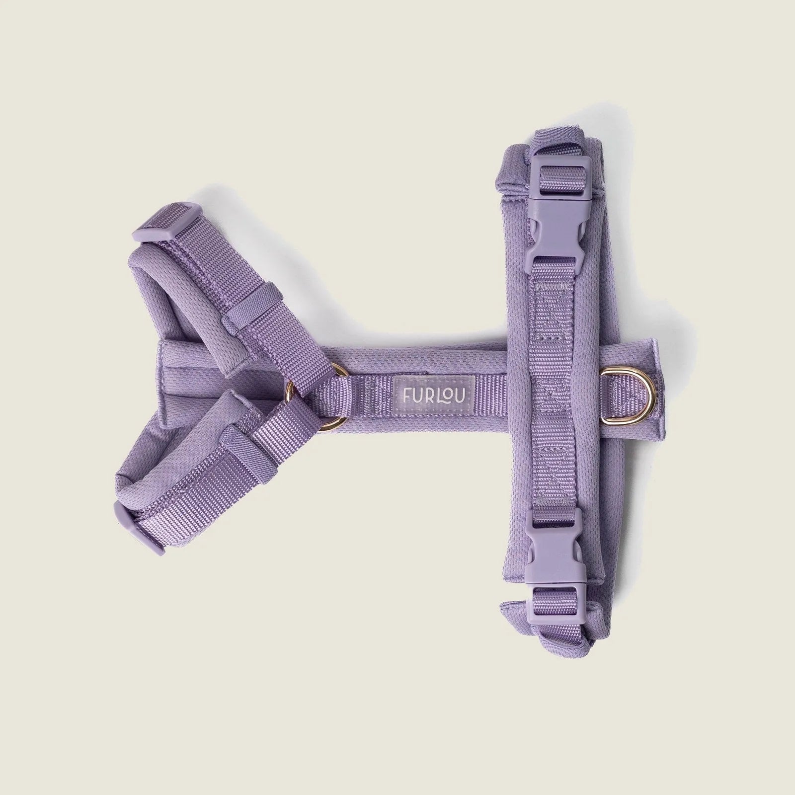 Lavender comfort dog harness featuring padded fabric, adjustable straps, and gold hardware for added style.