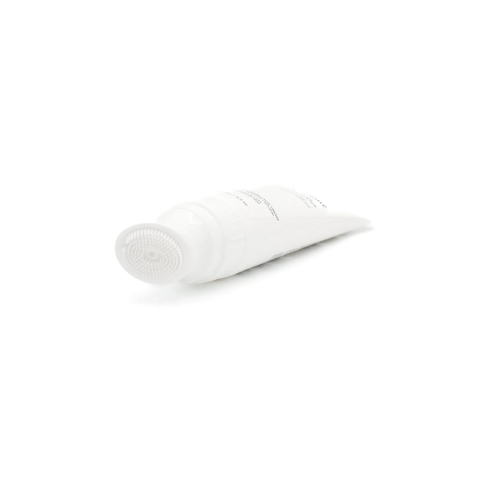 White tube of Le Paw Cream with a silicone bristle applicator, ideal for moisturizing and soothing pet paws.