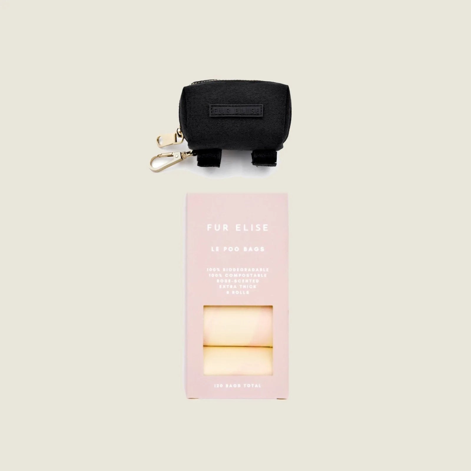 Le Poo Bundle features a black Oxford fabric pouch and rose-scented biodegradable waste bags in a pink box.