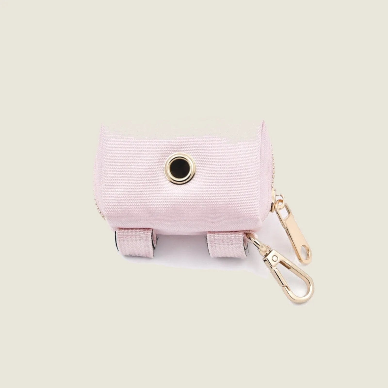 Light pink Le Poo Pouch made of durable Oxford fabric, featuring a gold lobster claw clasp and reinforced attachment.