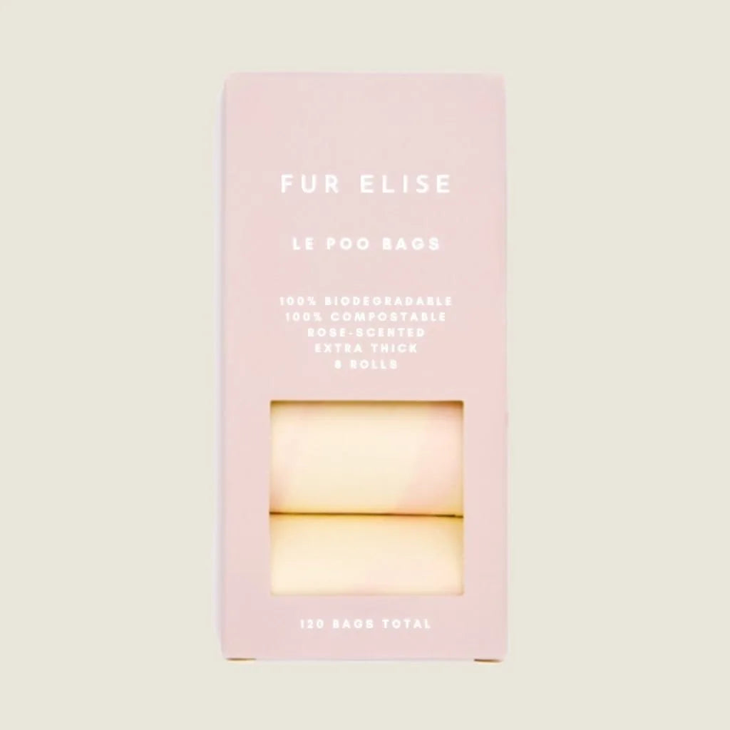 Le Poo Bundle packaging showcases rose-scented biodegradable bags with a soft pink box design.