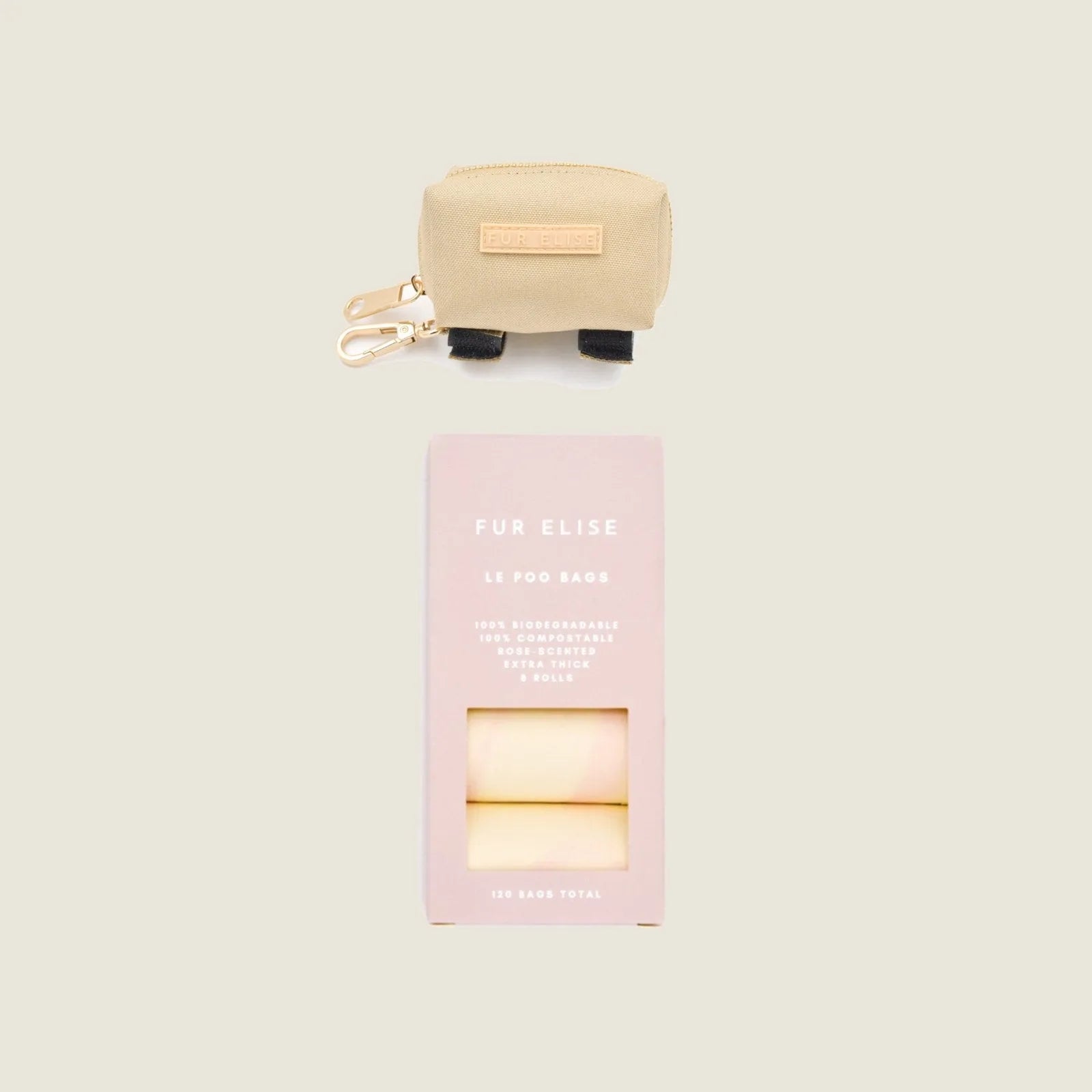 Beige Le Poo Pouch with gold clasp above a pale pink box of biodegradable rose-scented dog waste bags.
