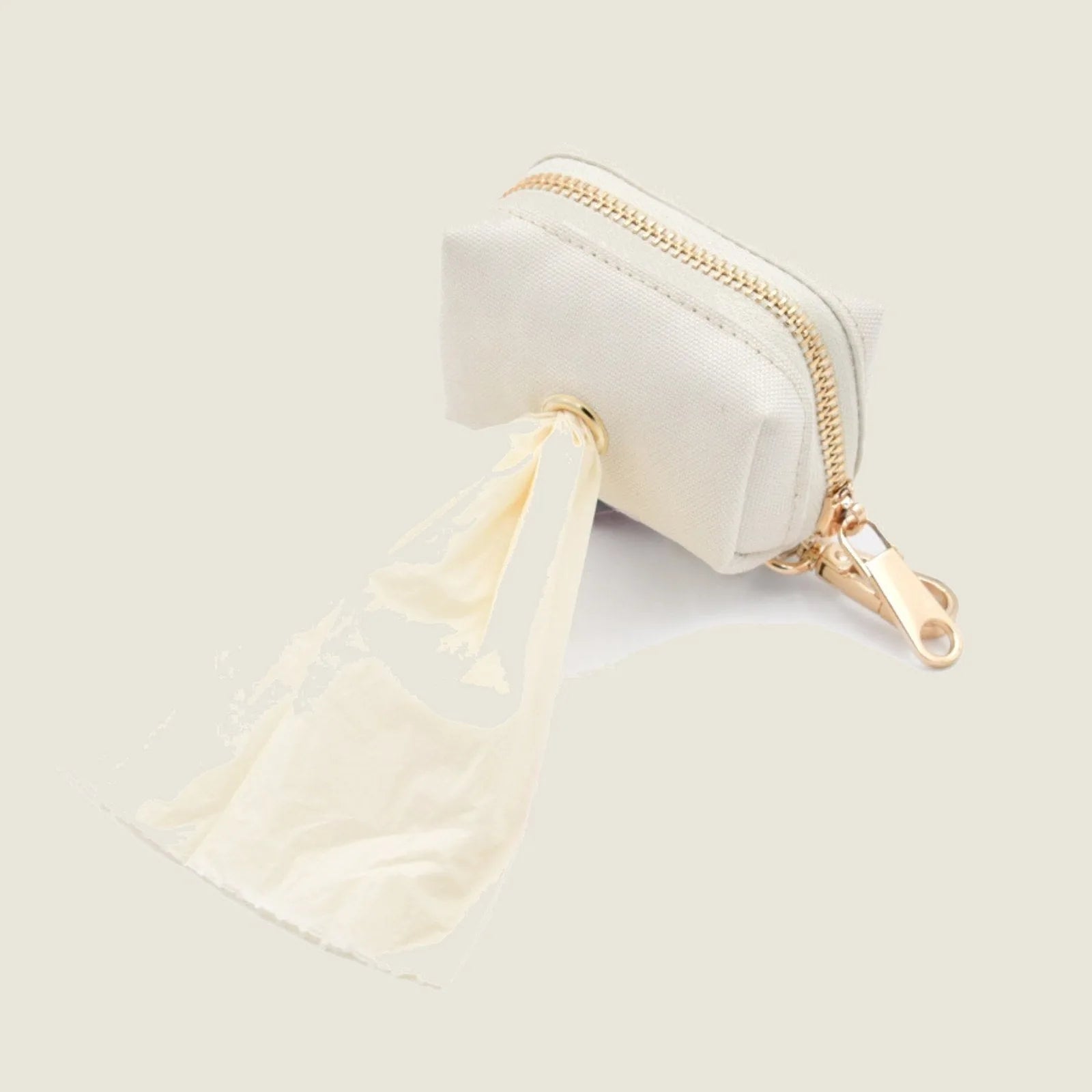 Lightweight bone-shaped pet waste dispenser in cream Oxford fabric with gold zipper, featuring a roll of waste bags.