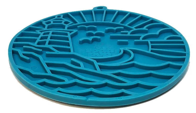 Dark blue silicone enrichment lick mat featuring a lighthouse design and textured surface for slow feeding.