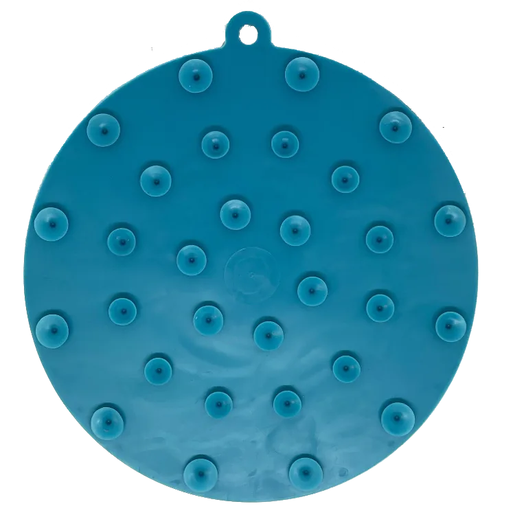Dark blue, round enrichment lick mat with textured surface and suction cups for secure use on smooth surfaces.