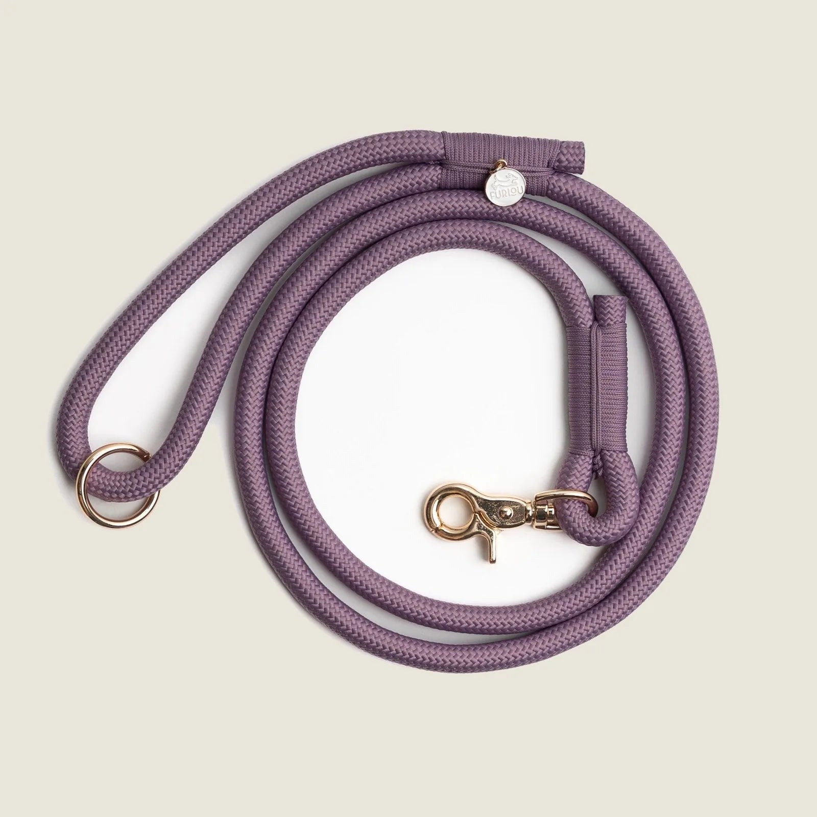 Lilac braided rope leash with reinforced stitching, featuring a gold clip and O-ring for accessories.