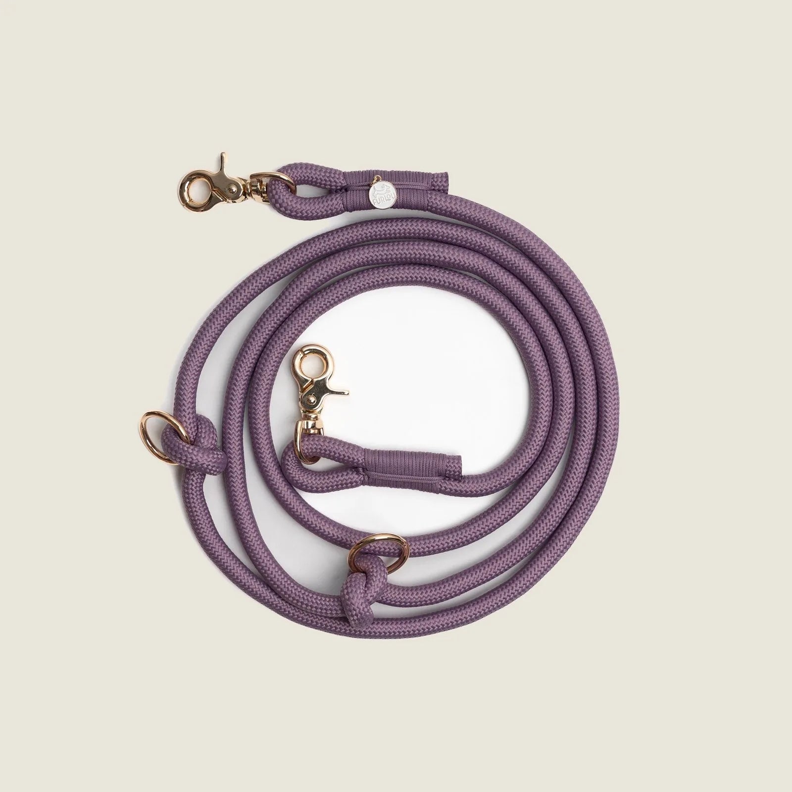 Lilac braided leash with gold-tone clips, designed for hands-free use and adjustable to fit various styles.