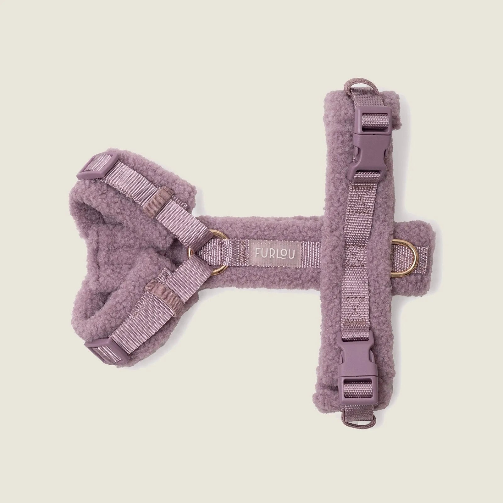 Lilac sherpa dog harness featuring adjustable straps and subtle gold details for comfort and style.