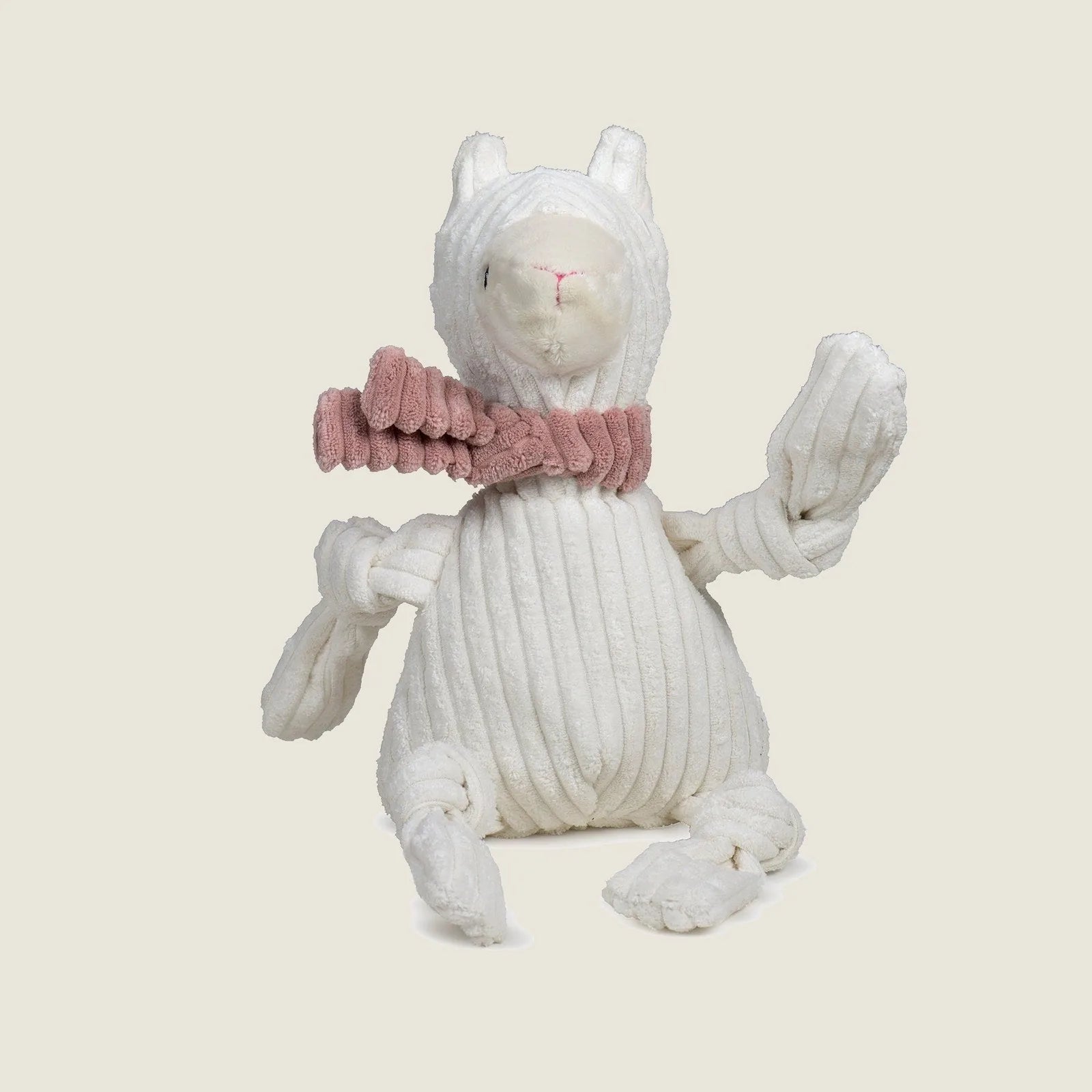 Lillie Llama Knottie® plush dog toy in white with a pink scarf, featuring knotted limbs for interactive play.