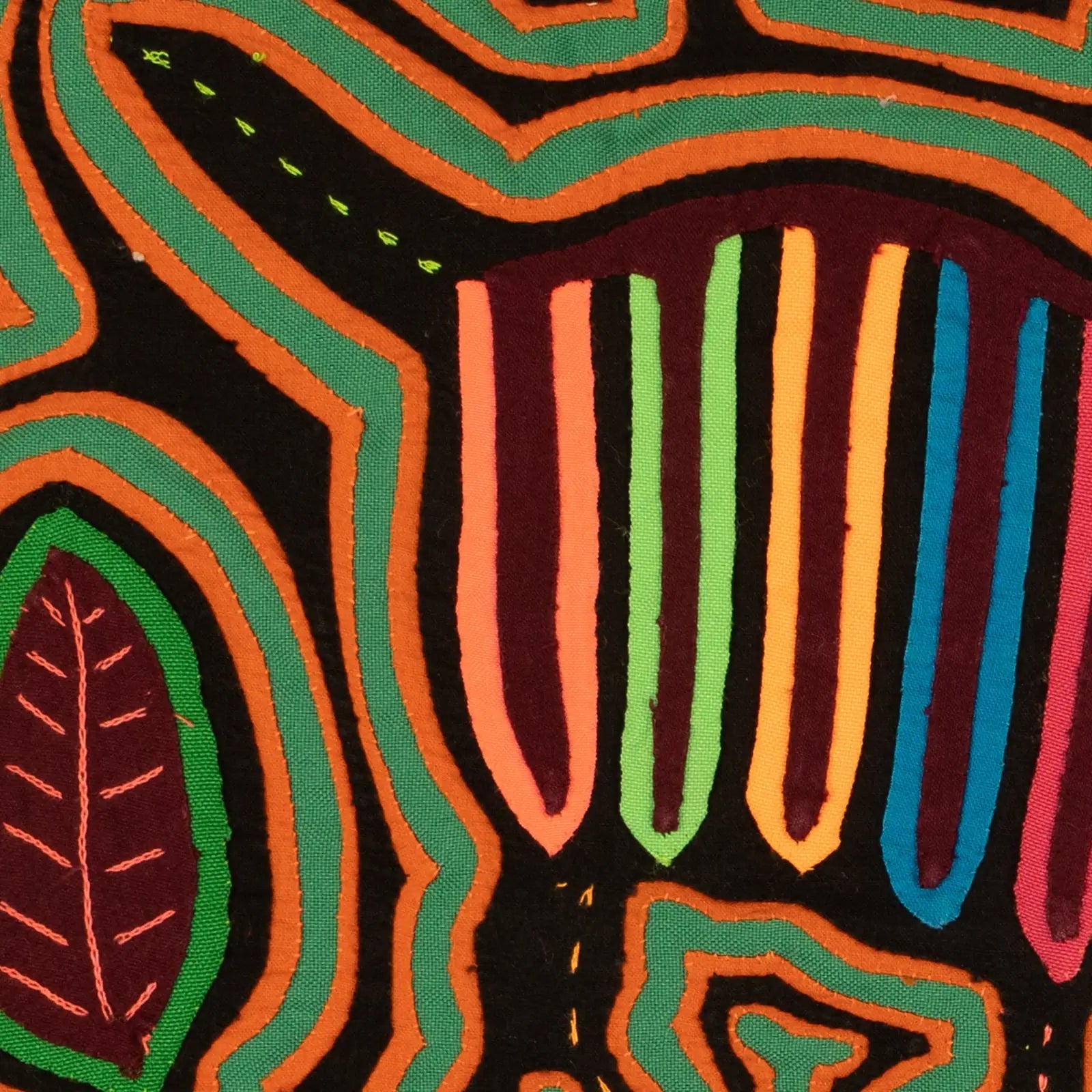 Colorful hand-stitched Mola featuring geometric patterns of vibrant greens, oranges, and purples on a dark background.
