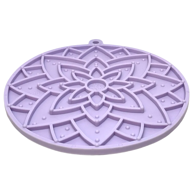 Pastel purple lotus-shaped enrichment lick mat with textured surfaces for pets, made from food-safe materials.