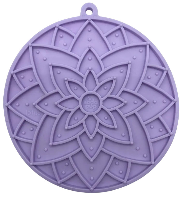 Pastel purple lotus-shaped lick mat with textured patterns for enrichment and slow feeding, made from food-safe materials.