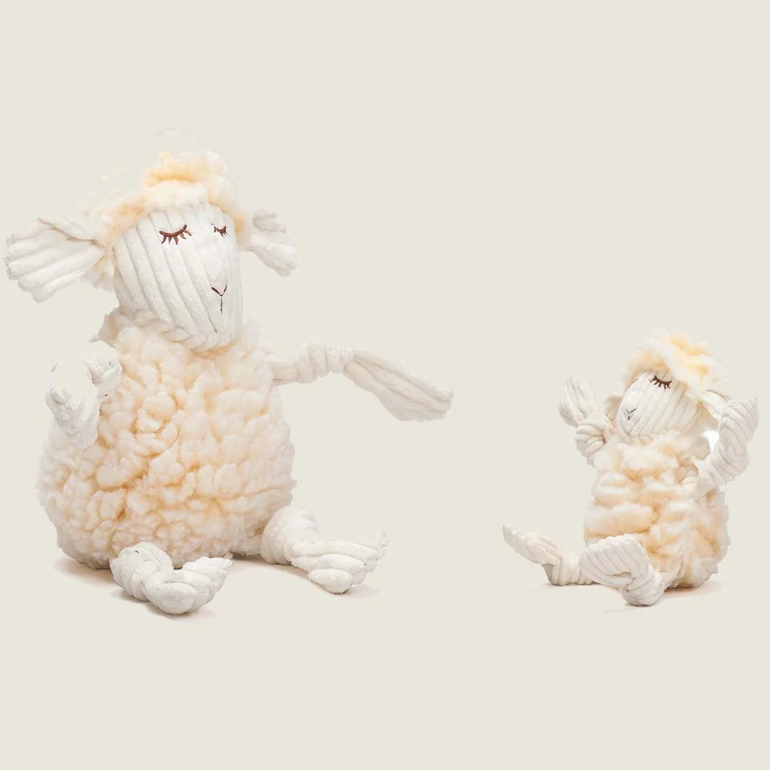 Plush Louise Lamb dog toy in soft cream and white, featuring knotted limbs and a cuddly, textured body.